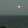 Moon rising over the ocean