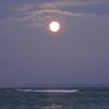 moon rising over the ocean